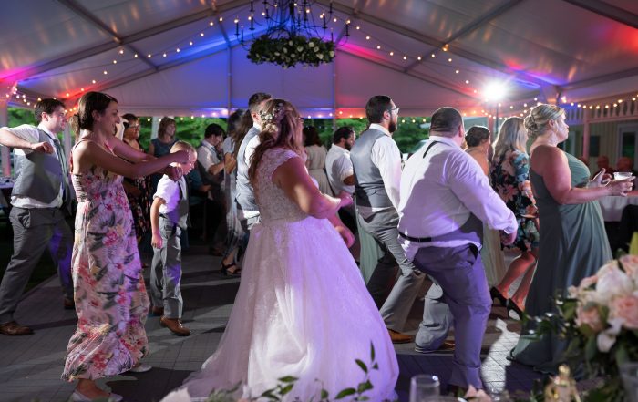 Dnncing at wedding in tented outdoor reception