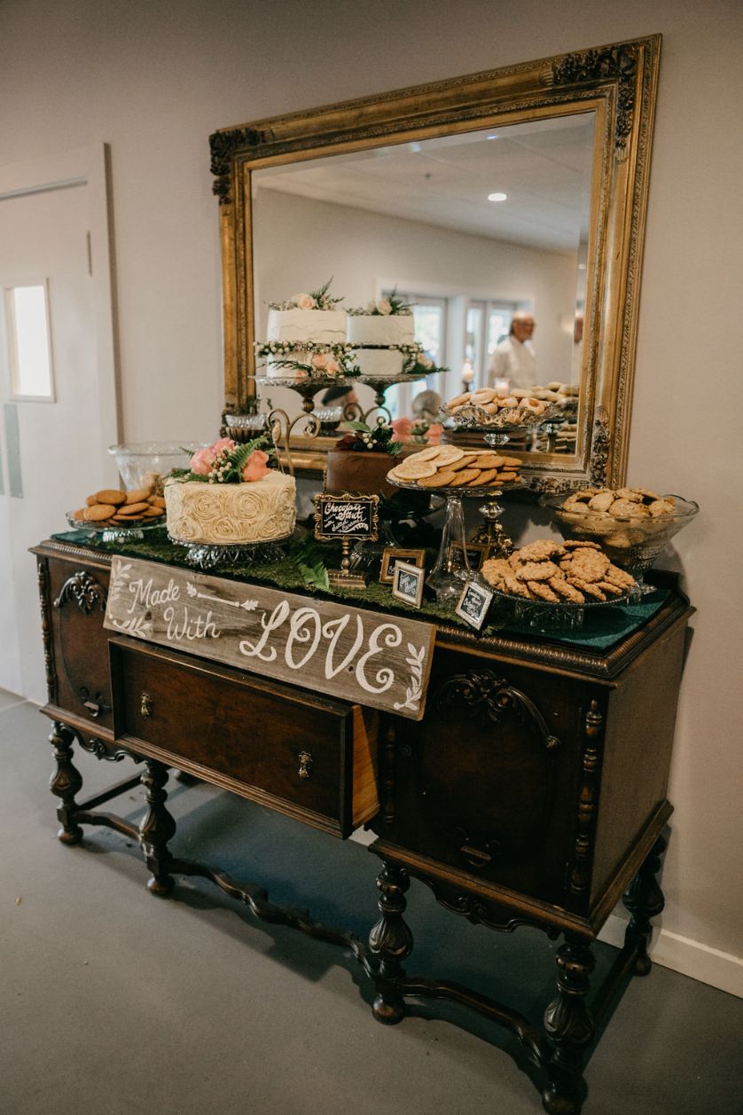 Stonegate Manor & Gardens Michigan wedding venue - Old fashioned set of drawers with wedding desserts including cookies and cake
