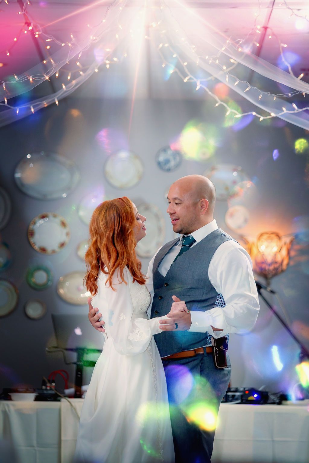 Stonegate Manor & Gardens Michigan wedding venue - wedding couple dancing under bright lights by dj table